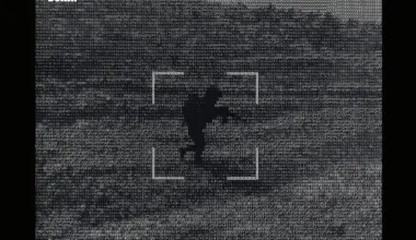 Pixelated grayscale poster for Dawn of the AI Drones by C.J. Chivers, featuring a silhouetted figure and geometric shapes against a textured background with green text overlay