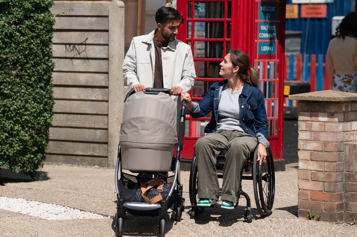573144,TITLE:Eastenders Penny and Vinny walking through the park with baby Ethan in a scene from EastEnders