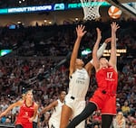 Las Vegas Aces center A’ja Wilson (22) attempts to rebound the ball at the same time as Portland Fire center Megan DiLeo (17) at the Moda Center in Portland, Ore., on July 9, 2026. DiLeo's corgi, Pancake, has become famous among Portland Fire fans.