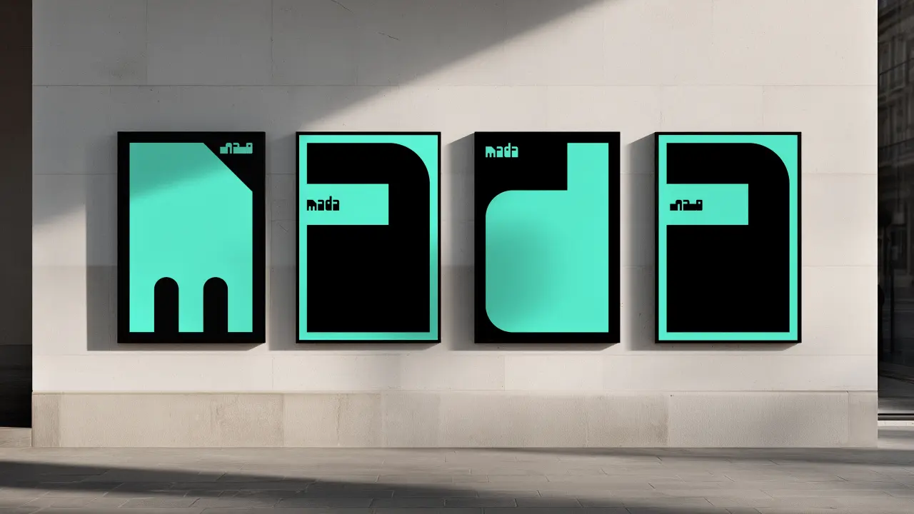 Four illuminated turquoise and black signage panels for Doha Design District displaying the mada maker space and event space branding on a white wall