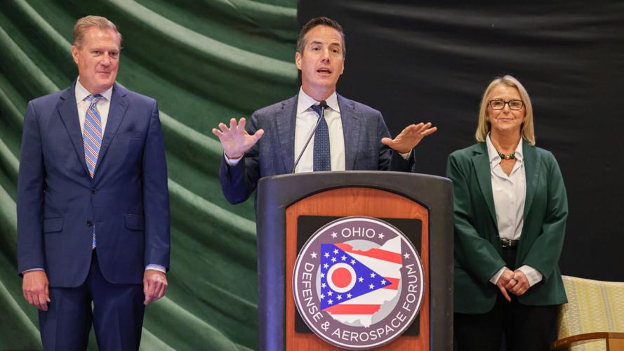 U.S. Sen. Bernie Moreno speaks while U.S. Rep. Mike Turner (left) and Wright Staet University President Sue Edwards (left) listen while Moreno announces a proposal for U.S. Space Academy that Ohio leaders are hoping the Trump administration establishes at Wright-Patterson Air Force Base. The proposal was announced during the Ohio Defense and Aerospace Forum on Monday, Sept. 21 at Wright State, which would be connected to the Space Academy.