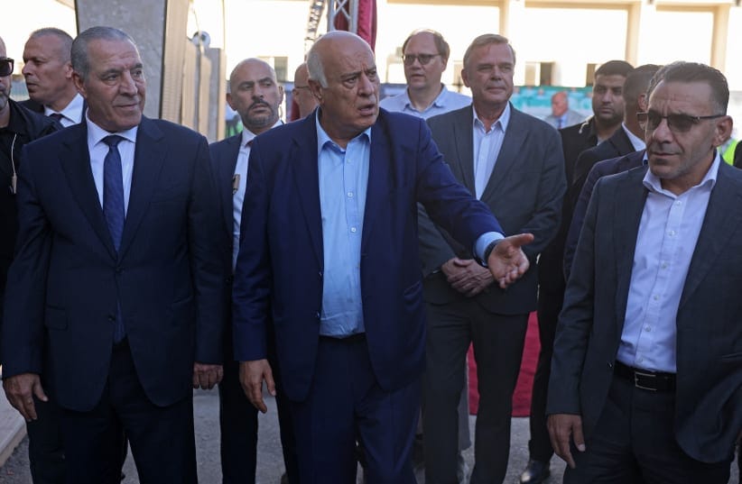  PALESTINIAN-ISRAEL-CONFLICT-WEST BANK Palestinian Vice President Hussein Al-Sheikh (L) and head of the Palestinian Football Association and Palestine Olympic Committee, Jibril Rajoub (C) arrive to attend the football match between Jabal Al-Mukaber and Shabab Al-Khalil teams.