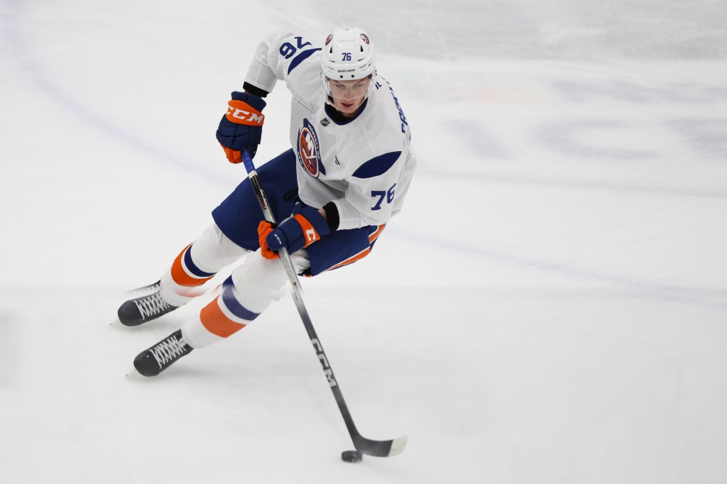 Daniil Prokhorov (76) playing hockey.