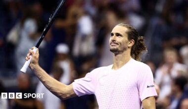 Alexander Zverev raises his racquet to the crowd
