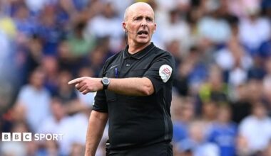 English referee Mike Dean gestures during the Premier League match between Chelsea and Watford