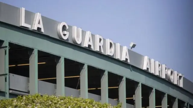 File photo of the green and white sign of New York City's LaGuardia Airport