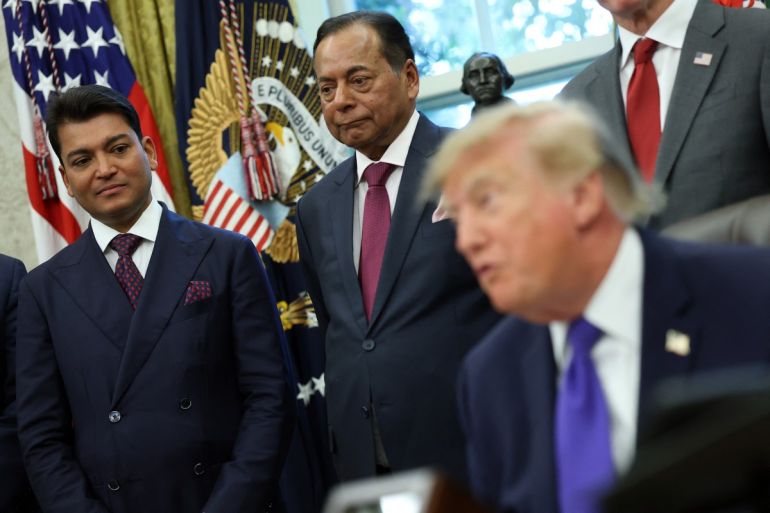 Rewant Ruia, left, chairman of Mesabi Metallics, and Ravi Ruia, centre, board member of Mesabi Metallics and director of Essar Capital, listen as US President Donald Trump delivers remarks at the White House on September 28, 2026