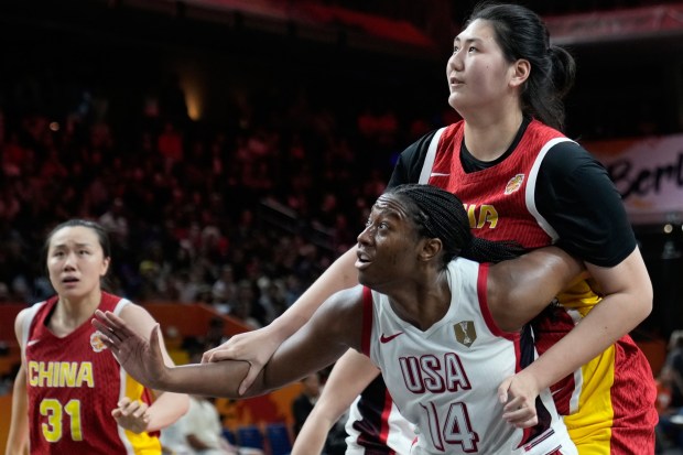 United States' Aliyah Boston blocks China's Zhang Ziyu during the Women's Basketball World Cup match between China and the United States in Berlin, Friday, Sept. 4, 2026. (AP Photo/Ebrahim Noroozi)