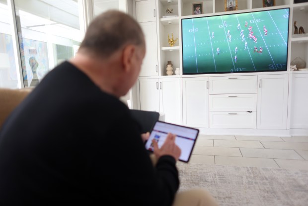 Greg Papa, the radio voice of the San Francisco 49ers watches game film of a pre season game on Monday, Aug. 17, 2026, in San Rafael, Calif. Aric Crabb/Bay Area News Group)