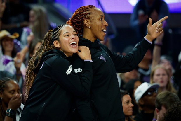 Golden State Valkyries' Veronica Burton (22) and Golden State Valkyries' Kayla Thornton (5) cheer on the sidelines after Golden State Valkyries' Kaitlyn Chen (2) makes a shot against the Portland Fire in the fourth quarter at Chase Center in San Francisco, Calif., on Friday, Sept. 18, 2026. (Shae Hammond/Bay Area News Group)