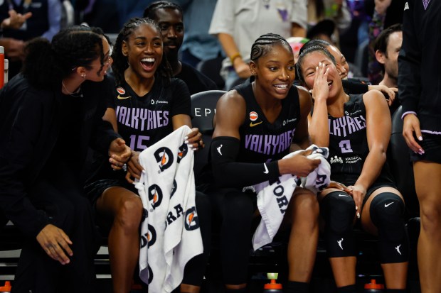 Golden State Valkyries' Kaitlyn Chen (2), Golden State Valkyries' Kaila Charles (6), Golden State Valkyries' Tiffany Hayes (15) and Golden State Valkyries' Gabby Williams (1) laugh on the bench during a game against the Portland Fire in the fourth quarter at Chase Center in San Francisco, Calif., on Friday, Sept. 18, 2026. (Shae Hammond/Bay Area News Group)