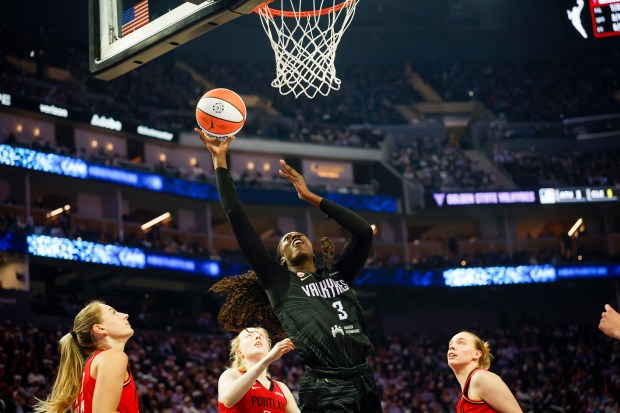 Golden State Valkyries' Laeticia Amihere (3) takes a shot against Portland Fire's Karlie Samuelson (44), Portland Fire's Frieda Buhner (20), and Portland Fire's Holly Winterburn (77) in the second quarter at Chase Center in San Francisco, Calif., on Friday, Sept. 18, 2026. (Shae Hammond/Bay Area News Group)
