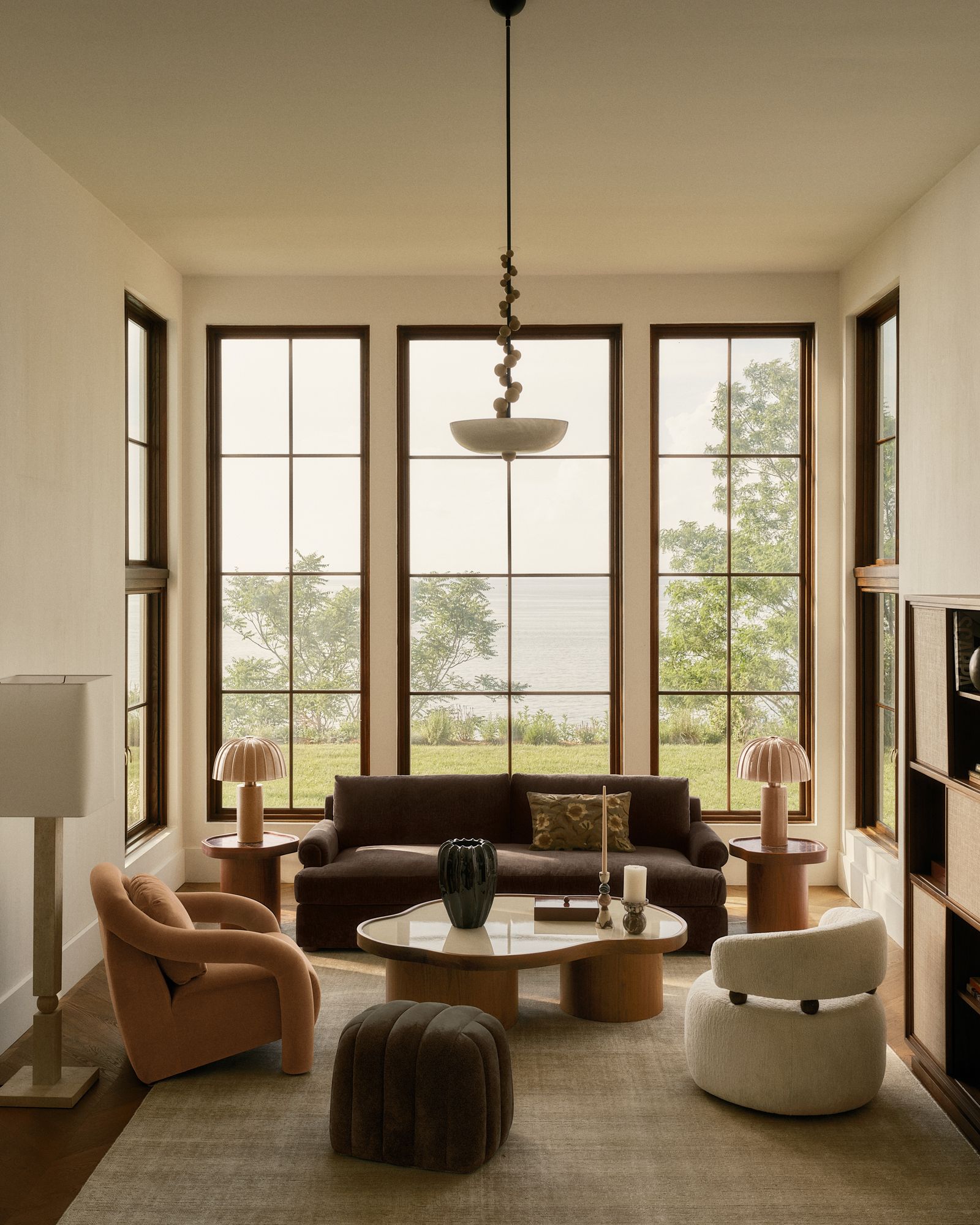 Image may contain Window Couch Furniture Candle Home Decor Rug Chair and Table