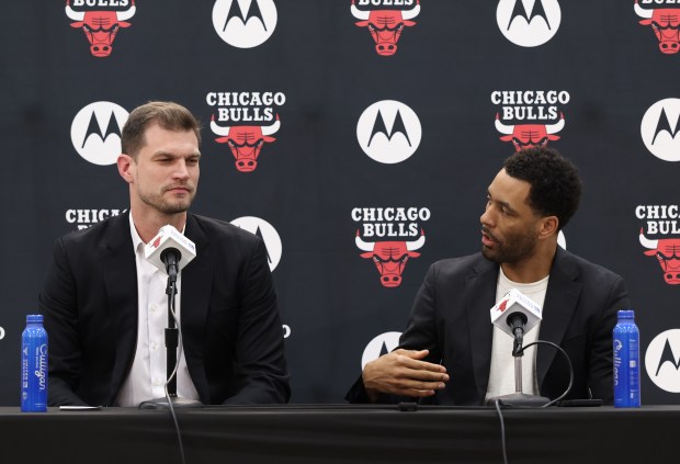 Bulls new coach Tiago Splitter, left, listens as executive vice president of basketball operations Bryson Graham speaks during a news conference on June 17, 2026, at the Advocate Center. (John J. Kim/Chicago Tribune)