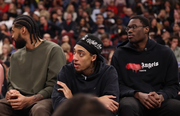 Bulls forward Noa Essengue, center, sits with teammates in the first quarter against the Magic at the United Center on April 10, 2026, in Chicago. (John J. Kim/Chicago Tribune)