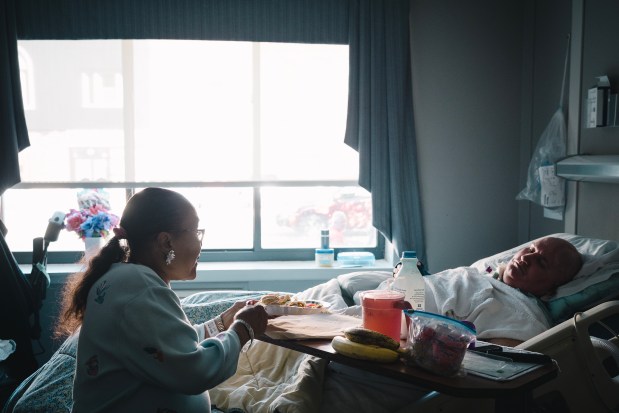 Teresita V. Morales' longtime partner Euġen Cuťa has lived in nursing homes for the past 16 years after suffering a stroke, Sept. 28, 2026. Cuťa recently received a letter from the state saying that he will lose Medicaid coverage as of Oct. 1 because of HR1, which bars certain types of immigrants from receiving Medicaid. (E. Jason Wambsgans/Chicago Tribune)
