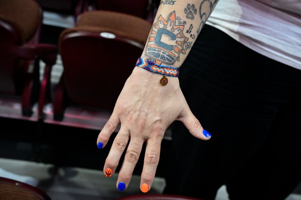 Connecticut Sun fan Mary Olivieri shows her Sun tattoo before the Sun's last WNBA basketball home game, Thursday, Sept. 24, 2026, at Mohegan Sun in Uncasville, Conn. The Sun are playing their final home game ever at Mohegan Sun in Connecticut before relocating to Houston. (AP Photo/Jessica Hill)