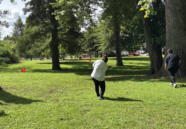 Faith Peoples takes her shot towards the bucket at Saturday's Delco Bucket Golf game at Rolling Green Park. (KATHLEEN E. CAREY - DAILY TIMES)