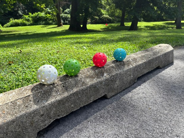 The balls used in the Delco Bucket Golf events are more like wiffle balls: plastic with holes in them. (KATHLEEN E. CAREY - DAILY TIMES)