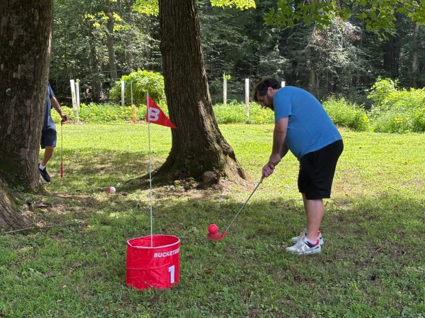 Ben Joyce takes a shot at Saturday's Delco Bucket Golf game at Rolling Green Park. (KATHLEEN E. CAREY - DAILY TIMES)