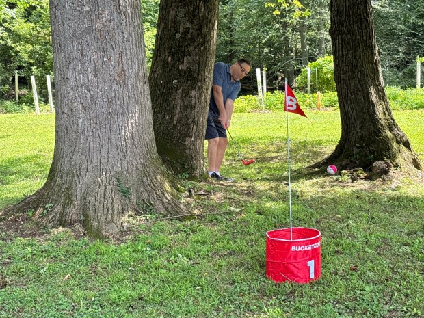 Delco Bucket Golf organizer Richard Butts said they use natural challenges like trees and bridges in the places they play bucket golf. (KATHLEEN E. CAREY - DAILY TIMES)