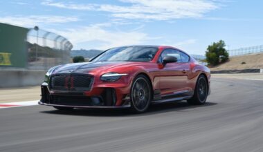 A red and black Bentley on track at Laguna Seca