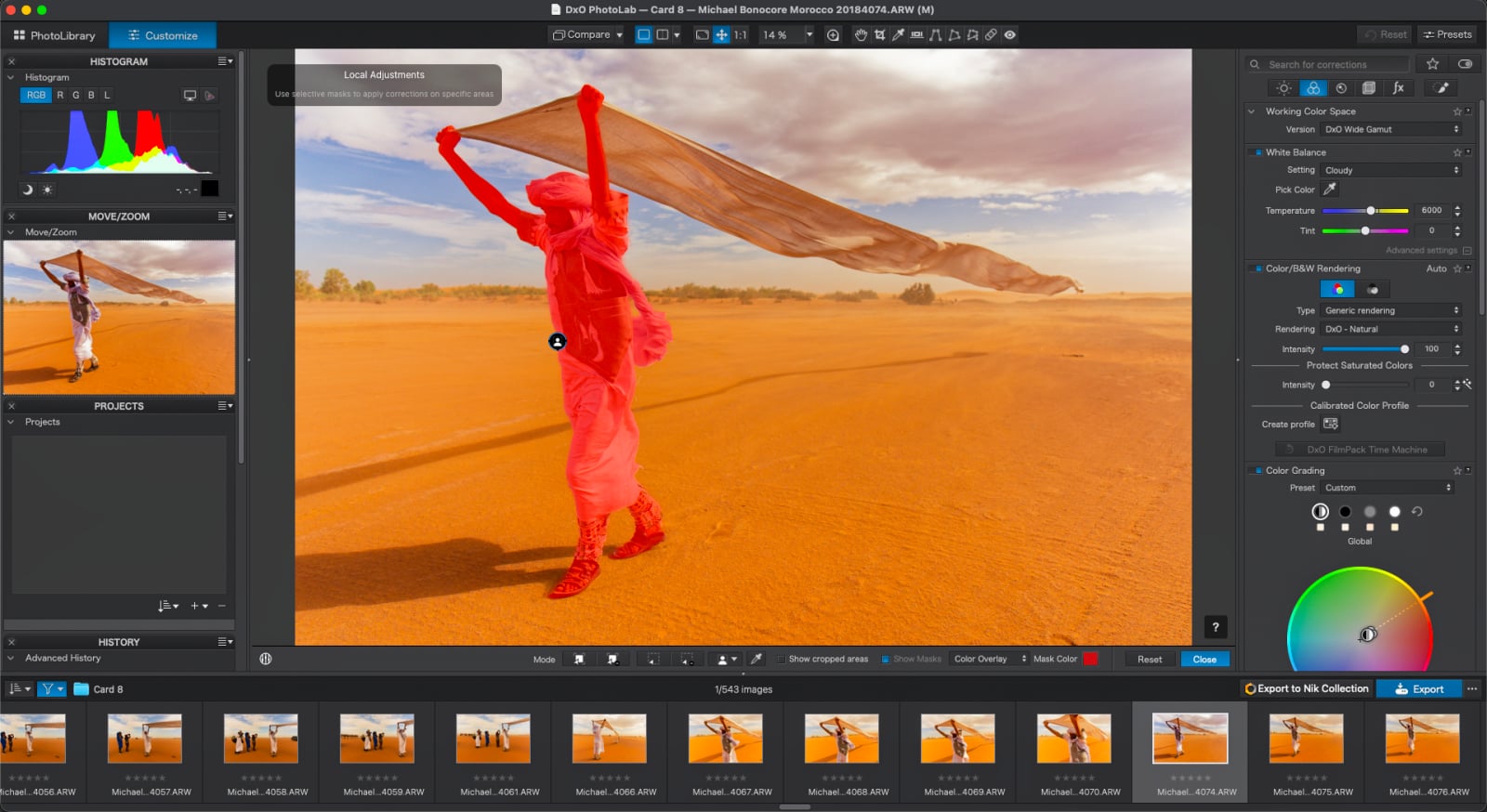 A person in traditional clothing holding a large cloth in a desert is highlighted with a red mask in the DxO PhotoLab editing software.