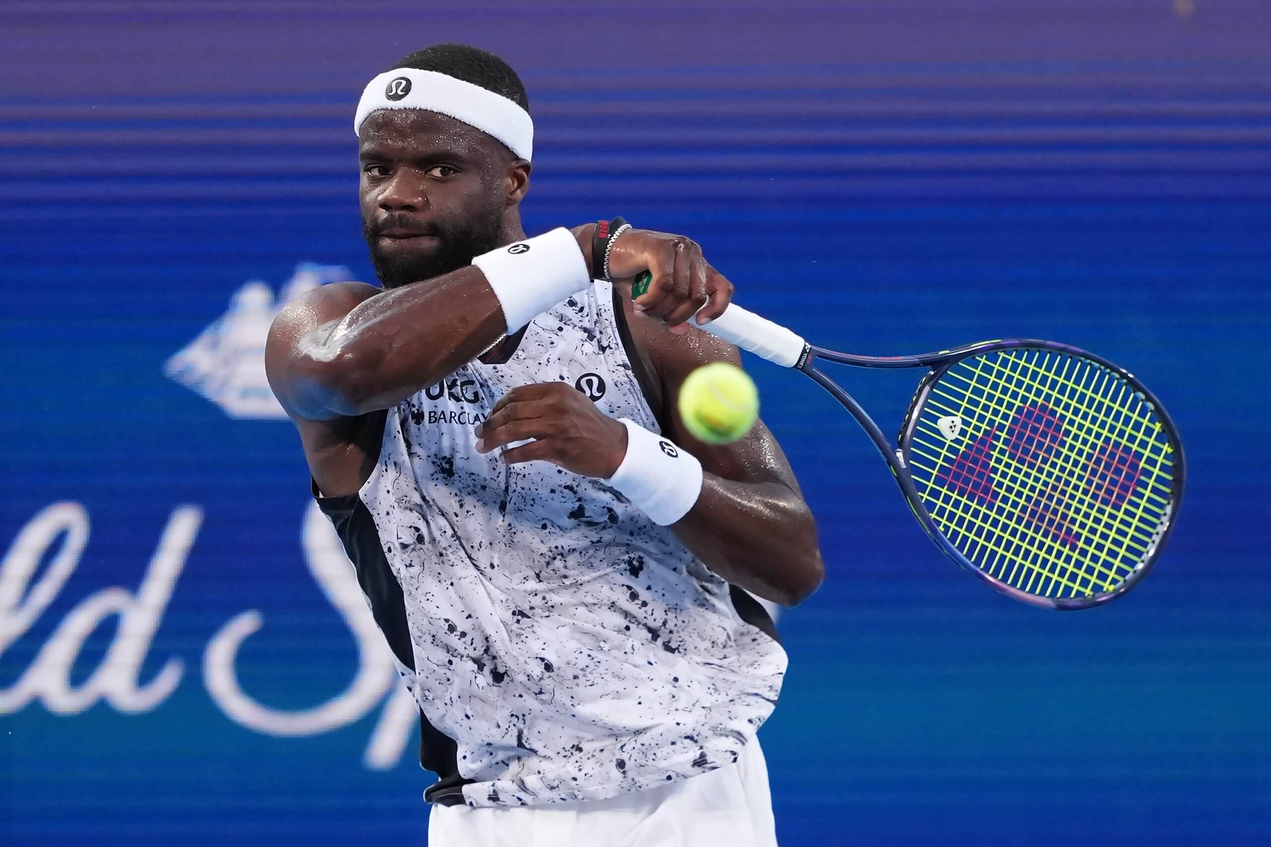 Frances Tiafoe follows through on a forehand.