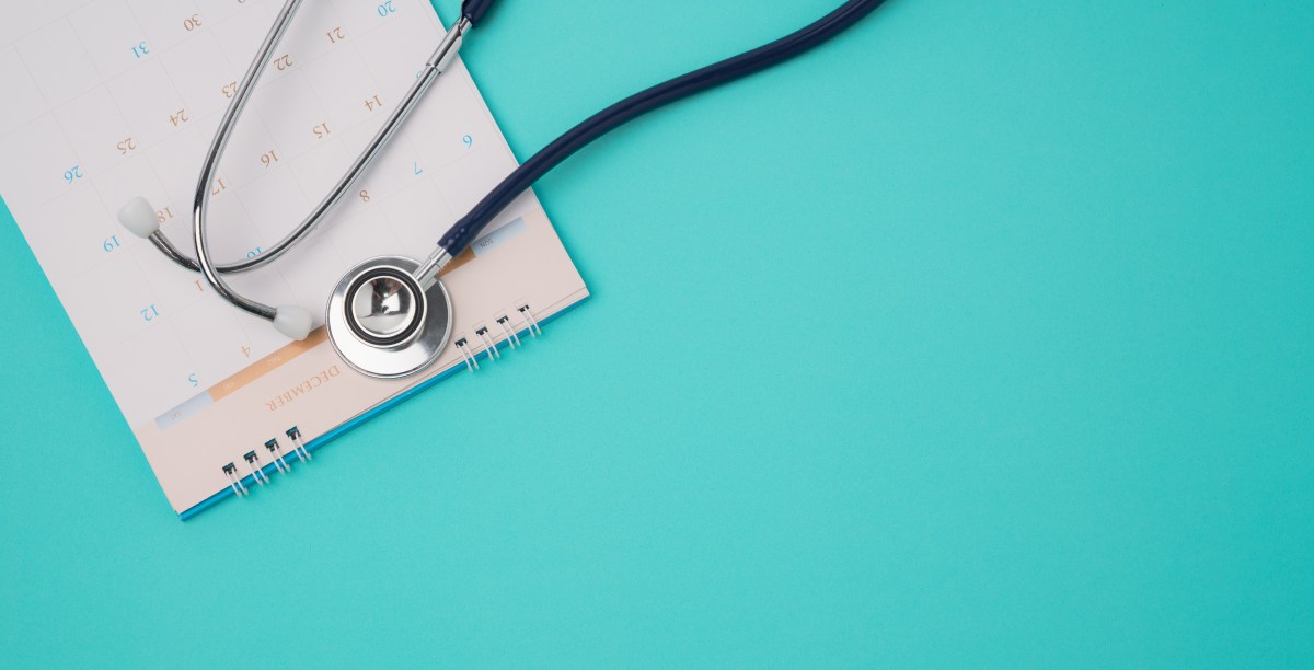 Stethoscope and a calendar. Doctor's appointment and service in the hospital.
