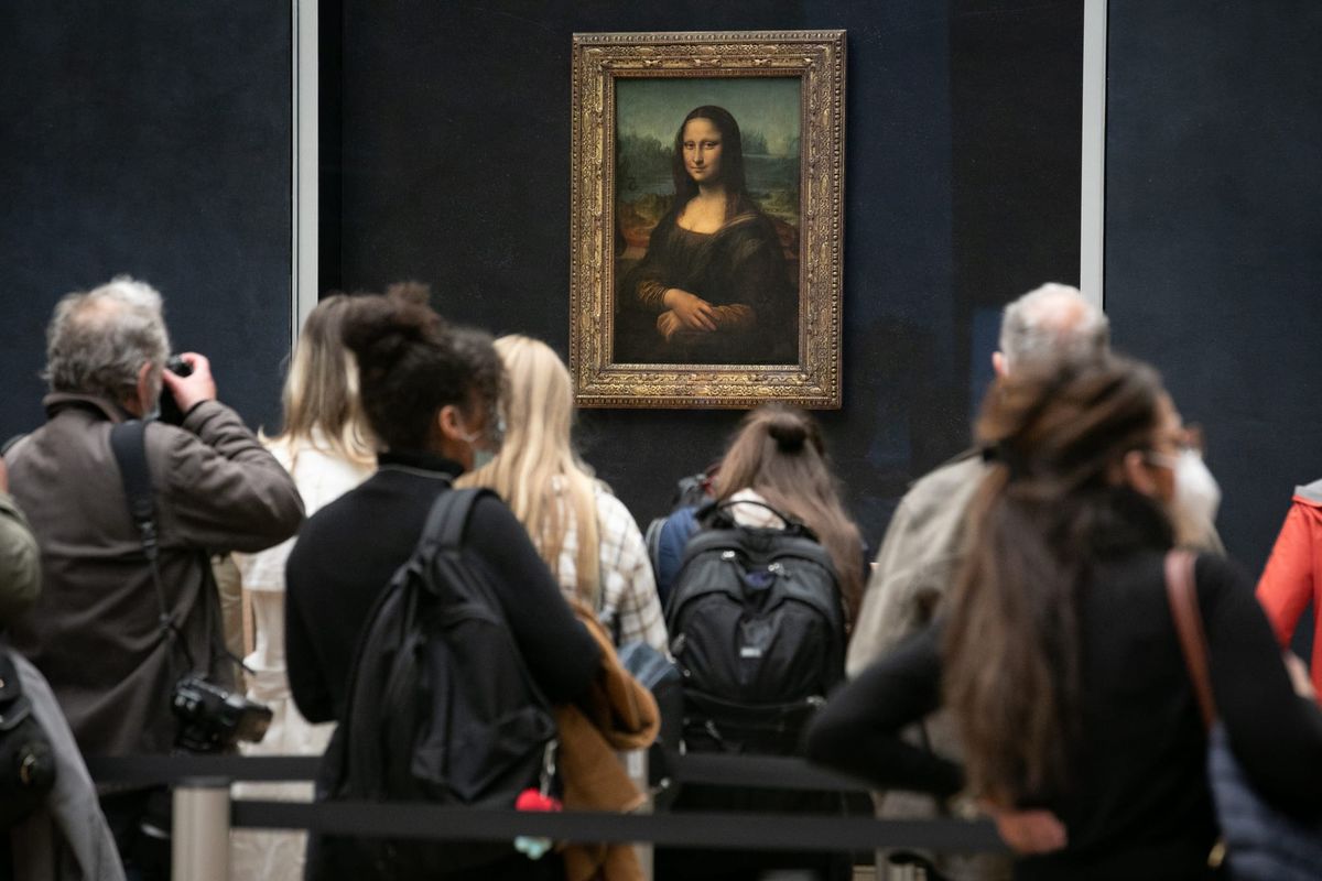 German Duo Arrested After Hanging Paintings Next to Mona Lisa