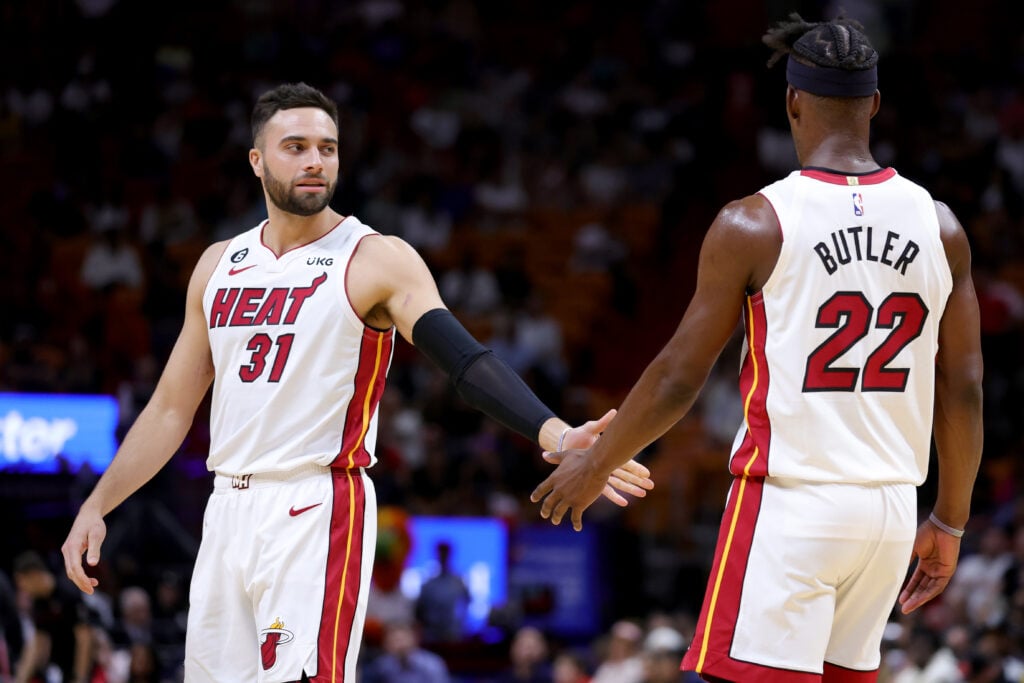 Max Strus #31 and Jimmy Butler #22 of the Miami Heat high five during the second quarter of the game against the Utah Jazz at Miami-Dade Arena.