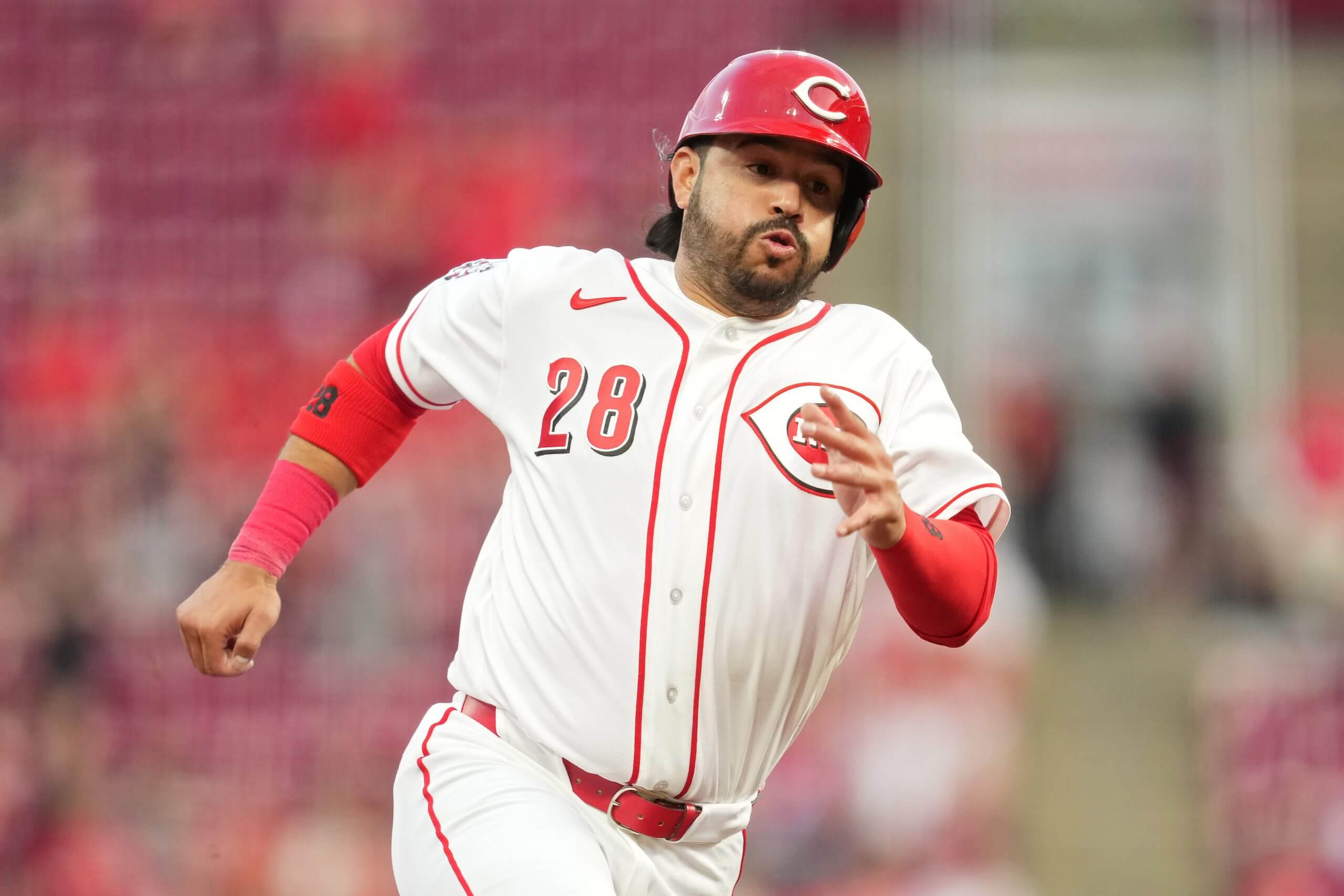 Eugenio Suárez #28 of the Cincinnati Reds rounds third base and scores on a triple hit by Will Benson #30 during the fourth inning of a baseball game against the Pittsburgh Pirates at Great American Ball Park on March 30, 2026 in Cincinnati, Ohio.