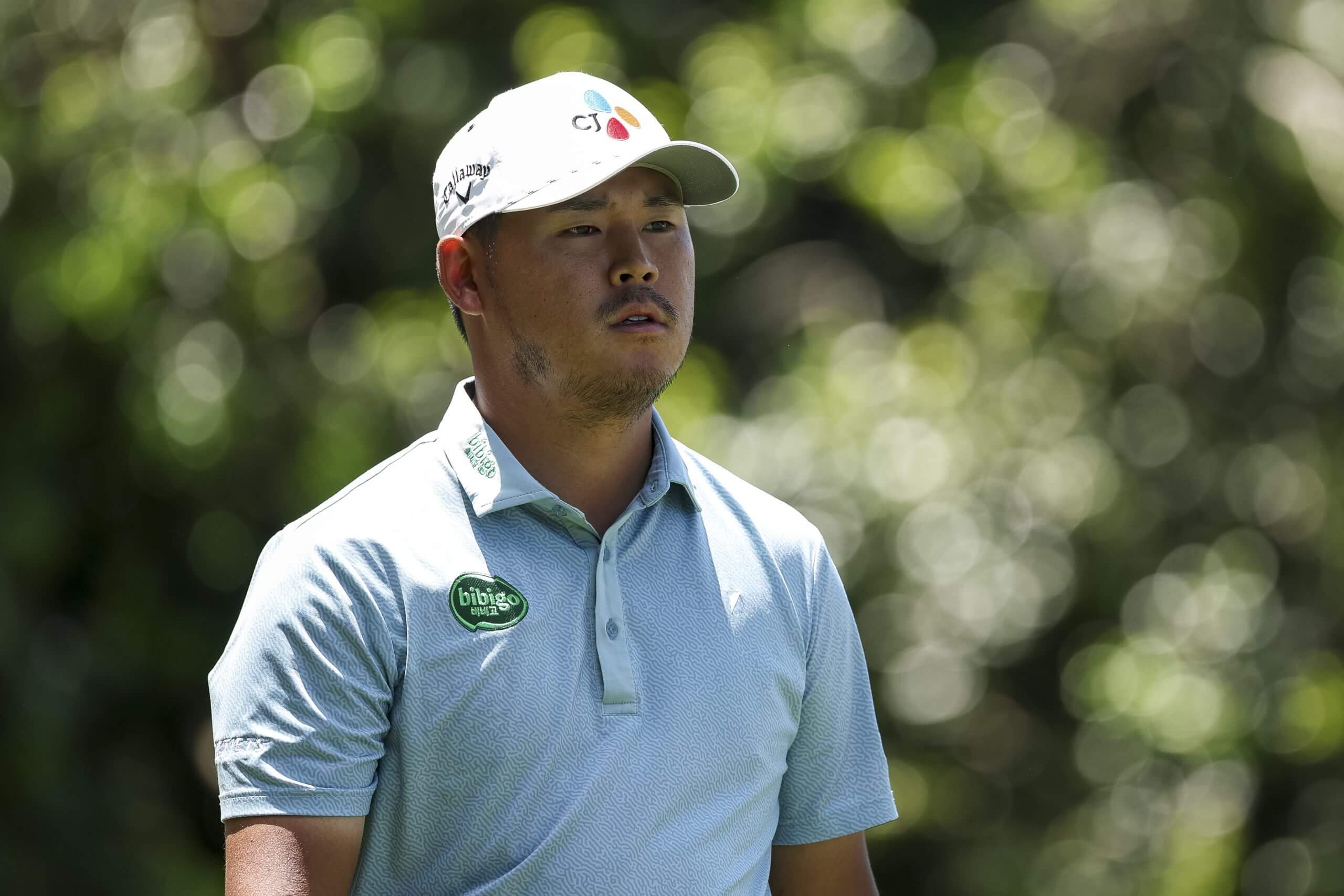 South Korean golfer Si Woo Kim walks on the course during a PGA Tour event.