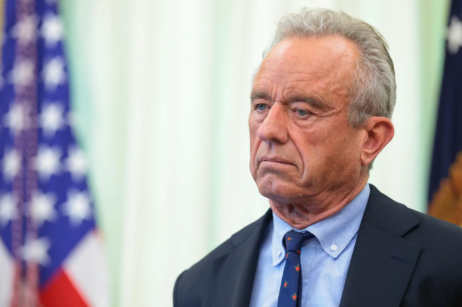 Health and Human Services Secretary Robert F. Kennedy Jr. joins President Donald Trump before he signs an executive order calling for childhood vaccine shots to be spaced out, during an event in the Oval Office of the White House on August 10, 2026, in Washington.