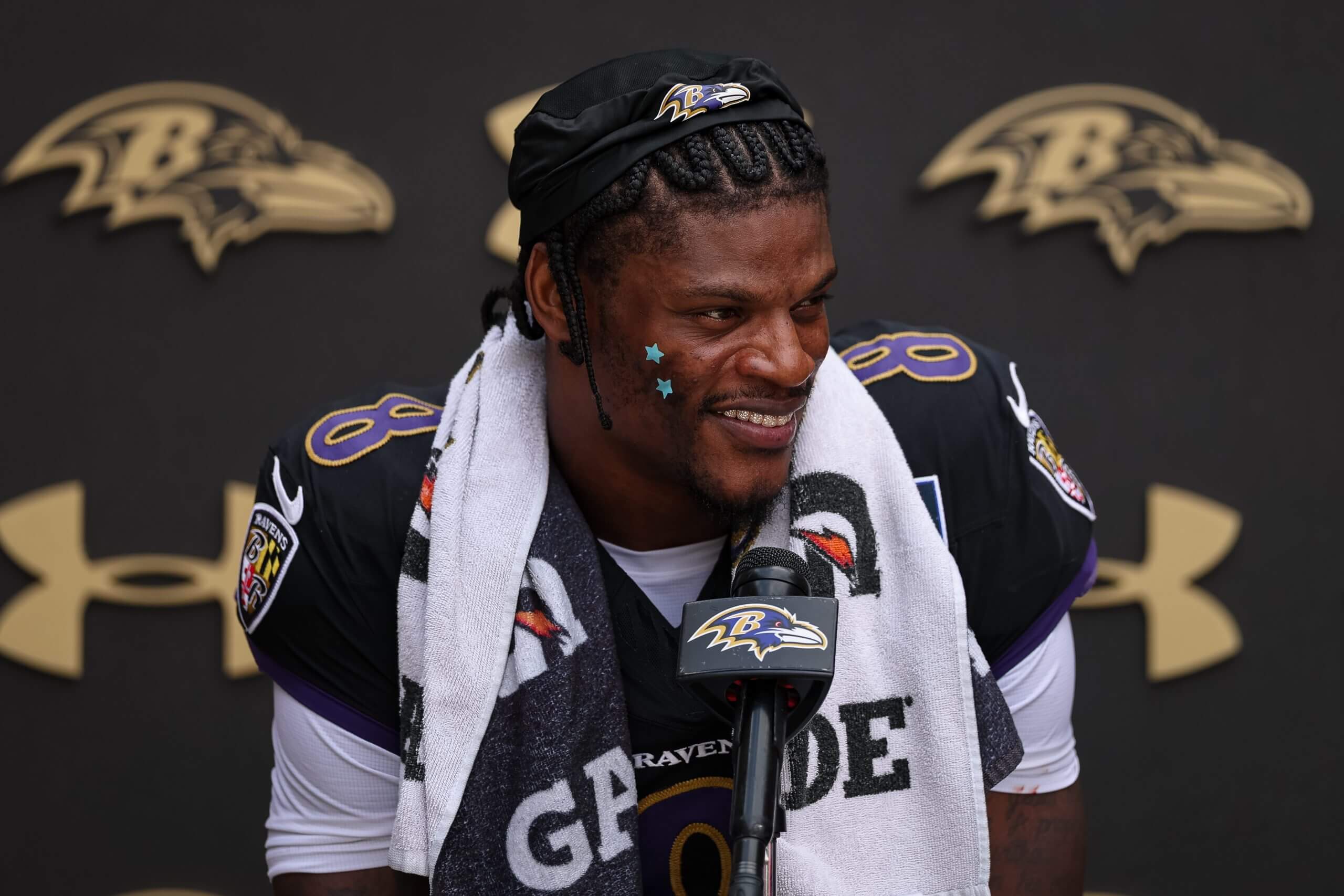 Lamar Jackson of the Baltimore Ravens speaks with media during the Washington Commanders and Baltimore Ravens joint practice at Under Armour Performance Center Baltimore Ravens on Aug. 26, 2026, in Owings Mills, Md.