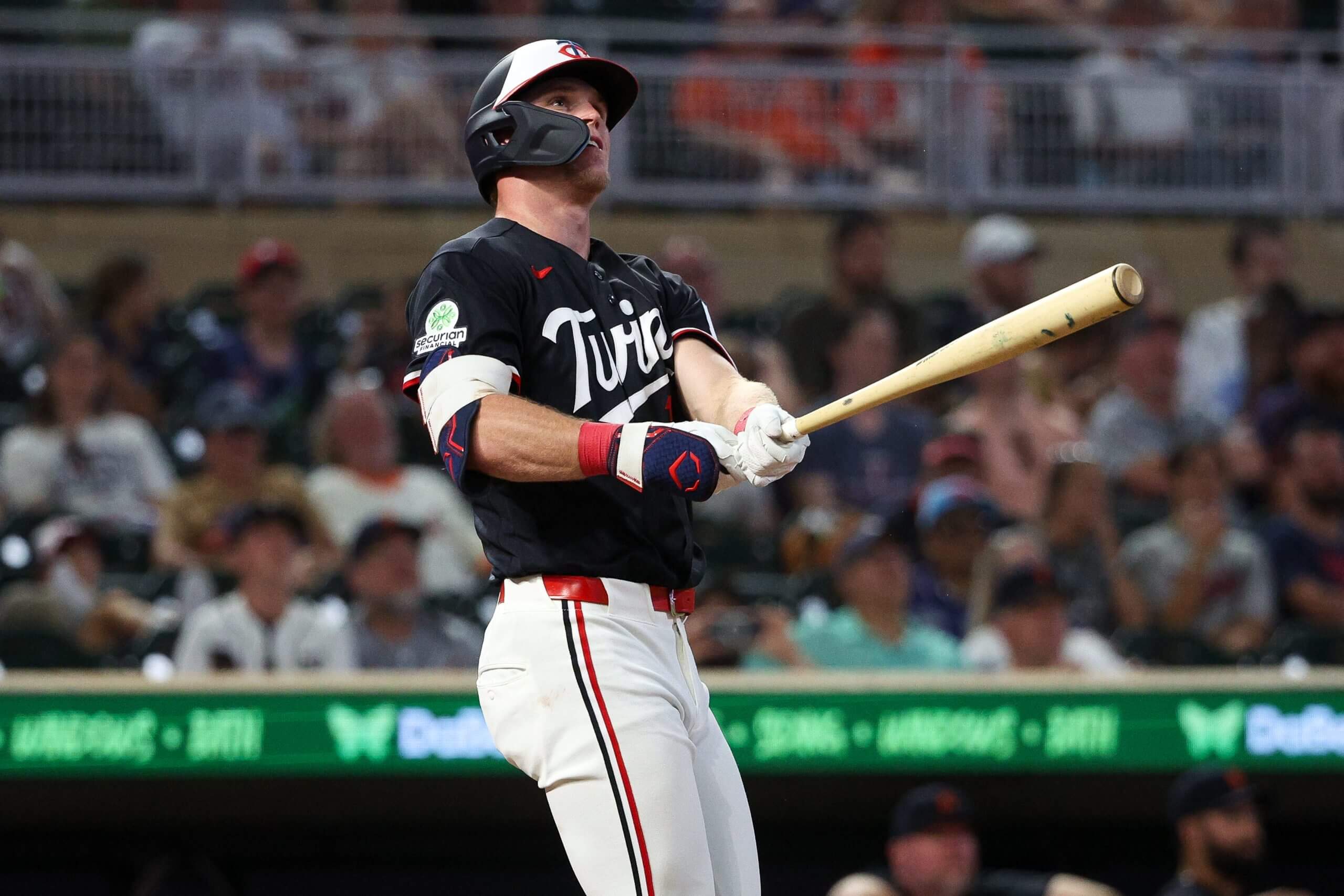 Walker Jenkins stands at the plate, holding the bat in front of him as he watches the path of his first major-league home run.
