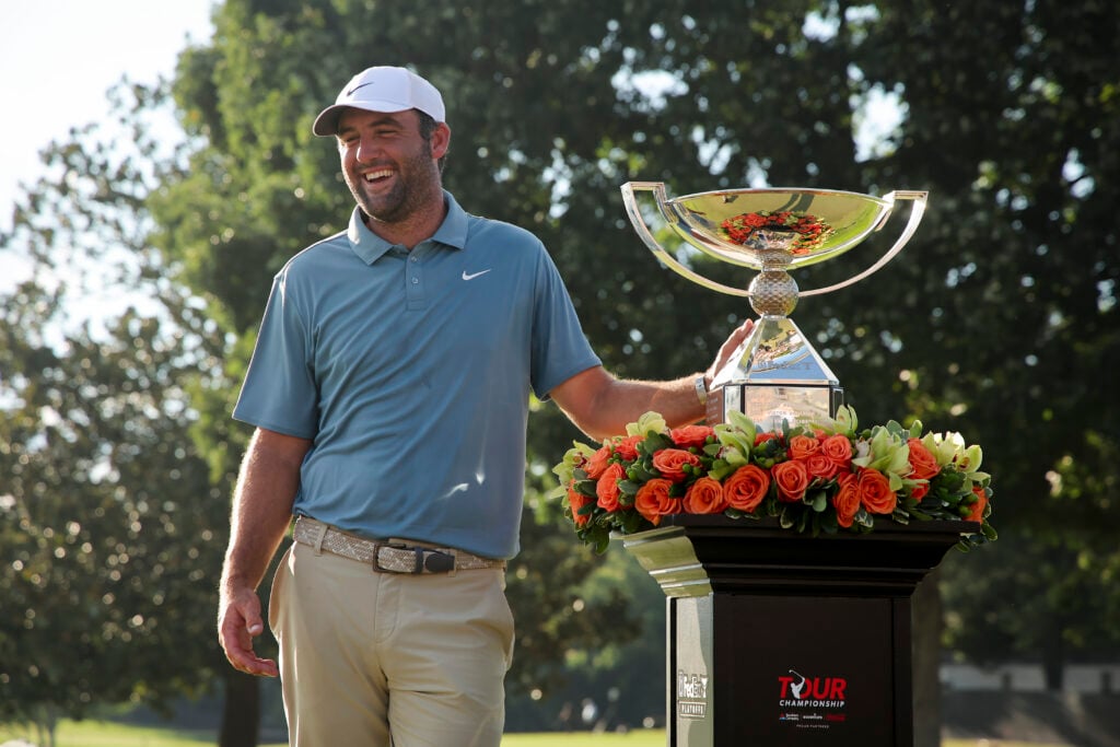 Scottie Scheffler of the United States stands next to the trophy after winning the final round of the TOUR Championship 2026 at East Lake Golf Club
