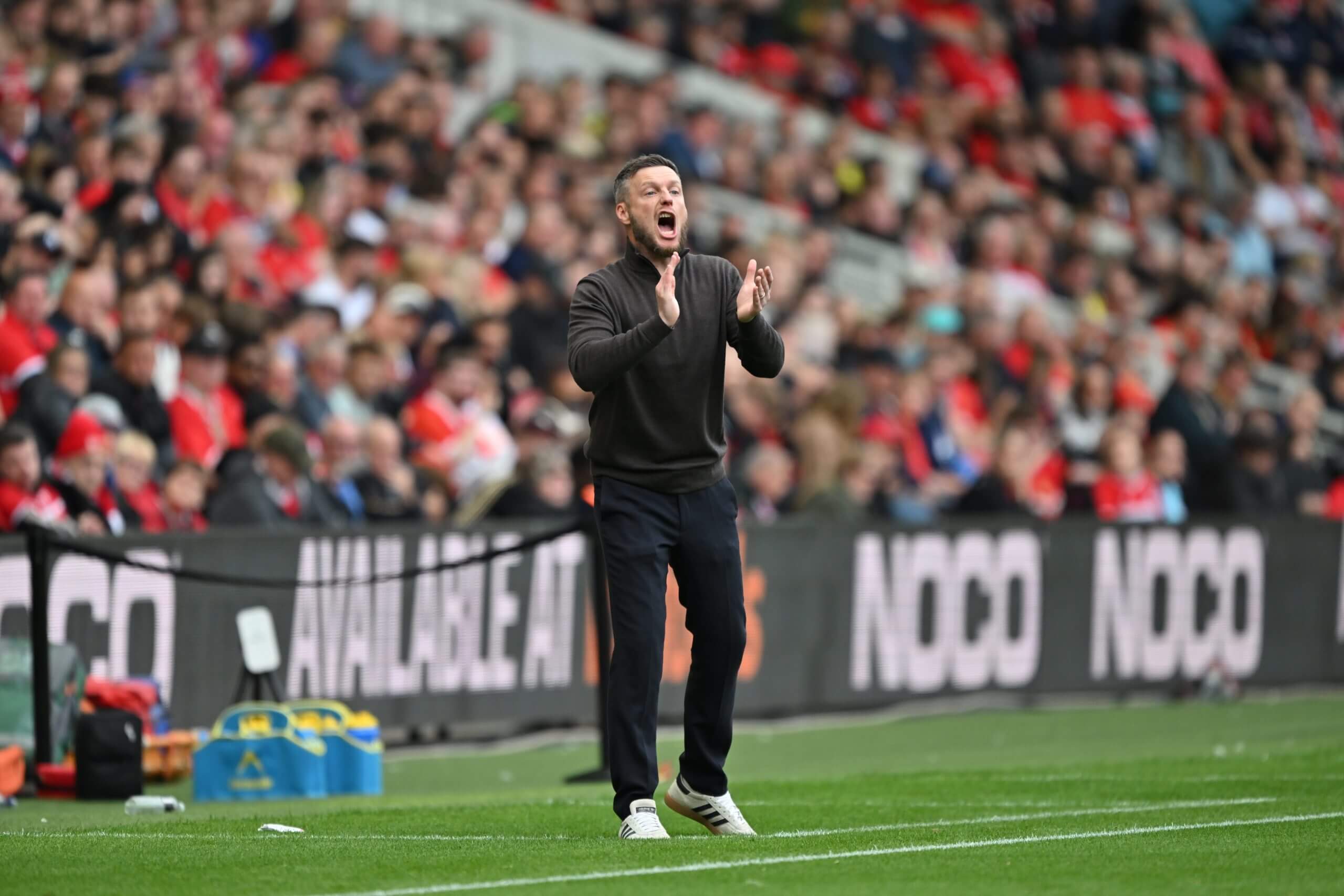 Kim Hellberg urges his players on from the sidelines against Norwich
