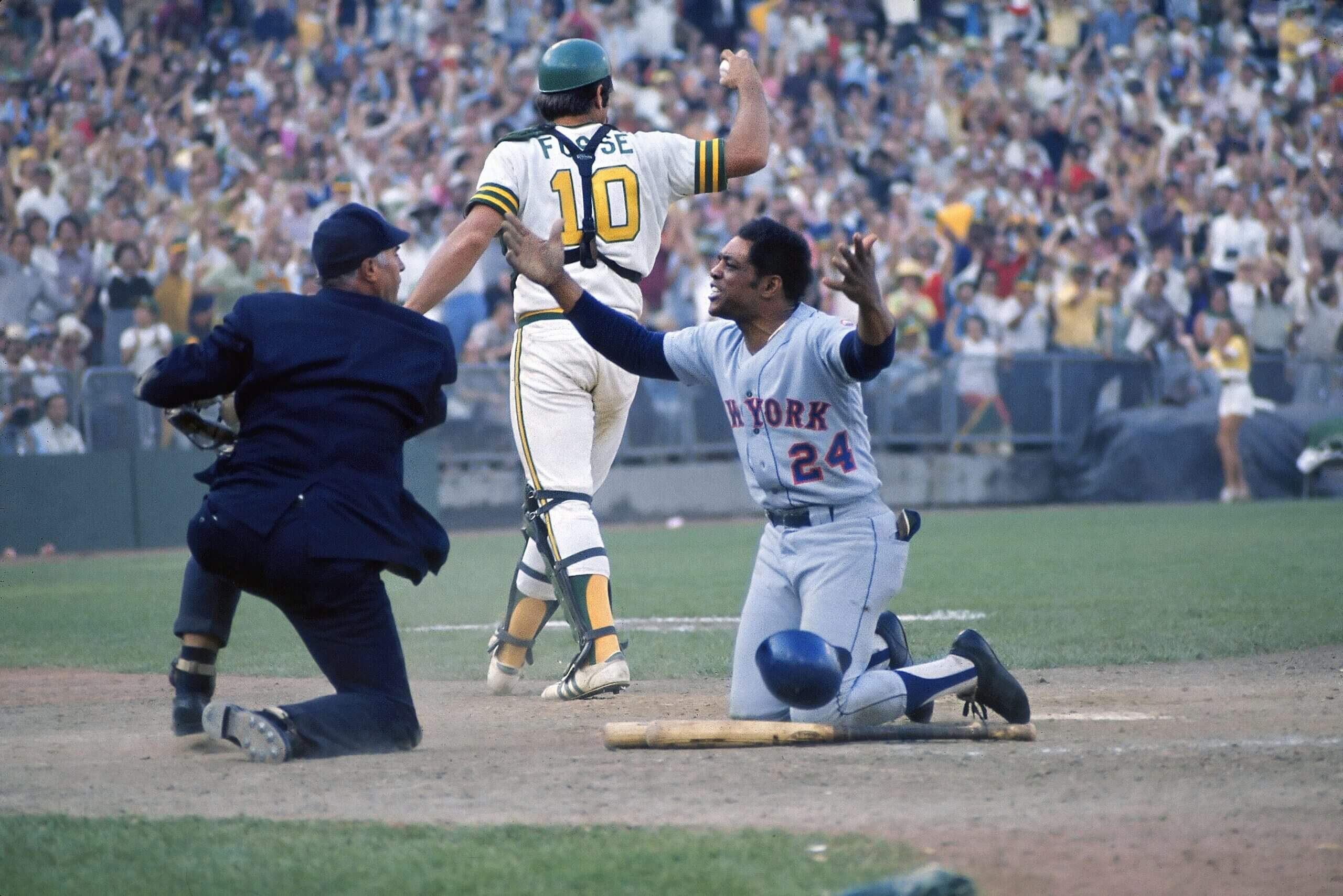 Willie Mays argues with umpire Augie Donatelli after Mets teammate Bud Harrelson was called out at home plate during Game 2 of the 1973 World Series. (Jerry Cooke / Sports Illustrated via Getty Images)