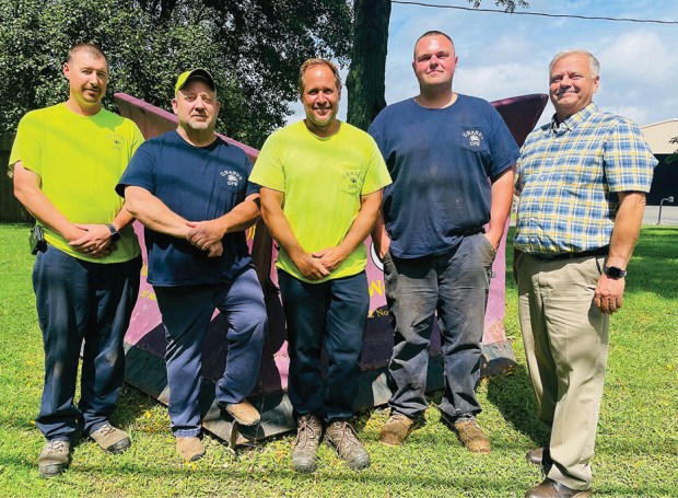 Keven Slyne, second from right, poses with coworkers from the Granby Public Works Department.