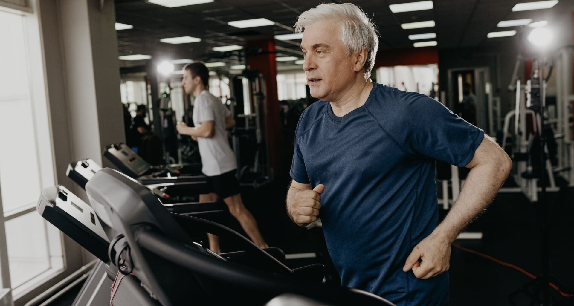 Senior man running on treadmill