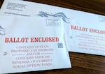 Two unopened Washington County ballots for Oregon's 2026 primary election sit on a table.
