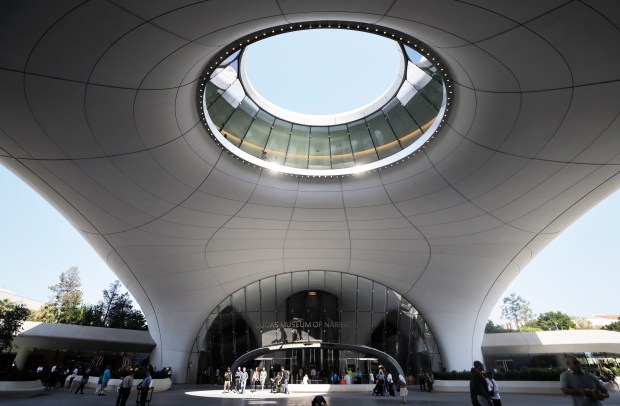 Visitors attend the sold-out opening day of the new Lucas Museum of Narrative Art, a 300,000-square-foot structure in Exposition Park, in Los Angeles.. Founded by filmmaker George Lucas and wife Mellody Hobson and designed by the architect Ma Yansong, it is billed as the "first museum dedicated to the universal human tradition of visual storytelling." The long-awaited institution is integrated into an 11-acre campus. (Photo by Mario Tama/Getty Images)