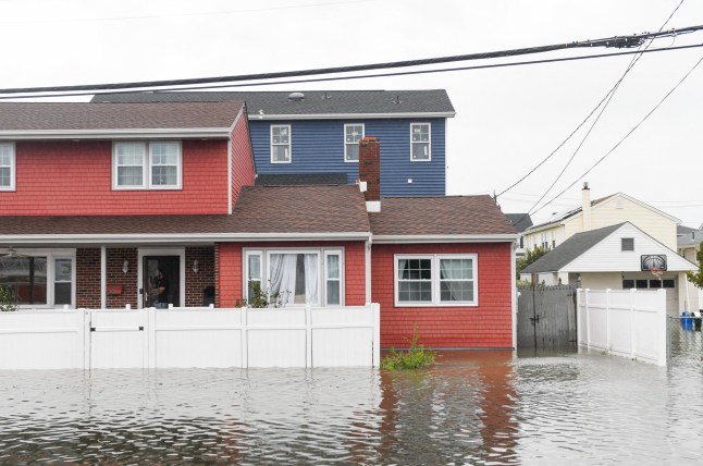 A flooded street is seen during a major nor'easter in Atlantic City, New Jersey, on September 26, 2026. Heavy rain and strong winds battered the northeastern United States as an unusually powerful autumn storm intensified, forcing the cancelation of hundreds of flights and leaving tens of thousands of people without power. New York, Boston and Philadelphia were all in the firing line of the "Nor'easter" -- so labeled for its northeasterly winds -- as authorities warned of potential major flooding and road closures. (Photo by Matthew HATCHER / AFP via Getty Images)