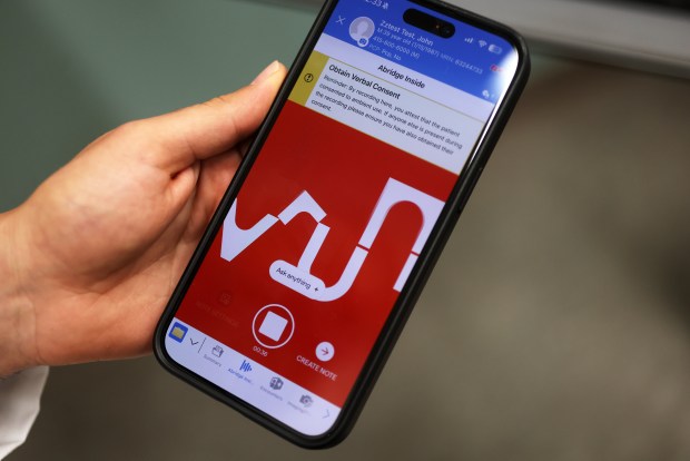Dr. Payvand Milani demonstrates using the Abridge Inside AI clinical documentation application on a cell phone at Sutter Health medical offices on Thursday, July 30, 2026, in Los Altos, Calif. (Aric Crabb/Bay Area News Group)