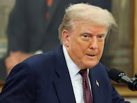 U.S. President Donald Trump speaks, as he and Apple CEO Tim Cook (not pictured) present Apple's announcement of a $100 billion investment in U.S. manufacturing, in the Oval Office at the White House in Washington, D.C., U.S., August 6, 2025. REUTERS/Jonathan Ernst