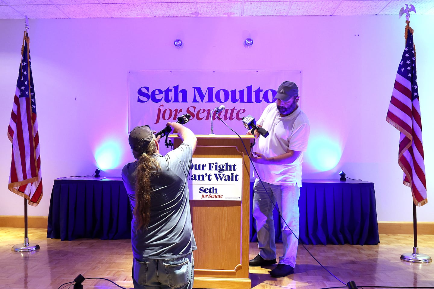 Technicians set up microphones at the election night party for Democratic Senate candidate US Representative Seth Moulton at the Plumbers & Gasfitters UA Local 12 in Dorchester.