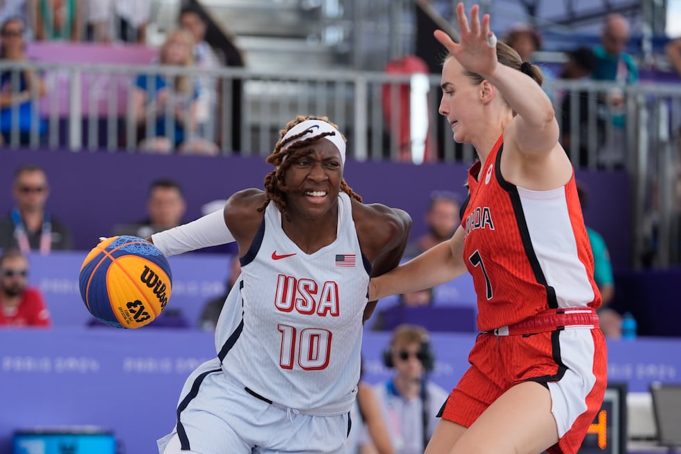 Canada's Paige Crozon (7) defends Rhyne Howard (10), of the United States, in the women's 3x3...