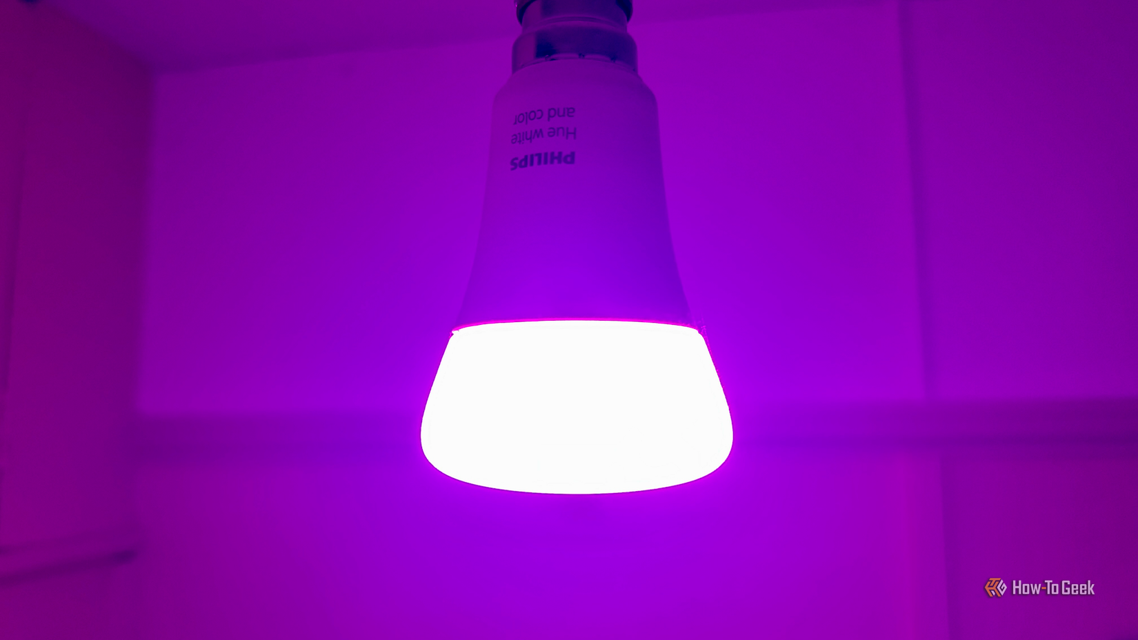 A smart bulb that has been turned purple on the whims of an LLM.