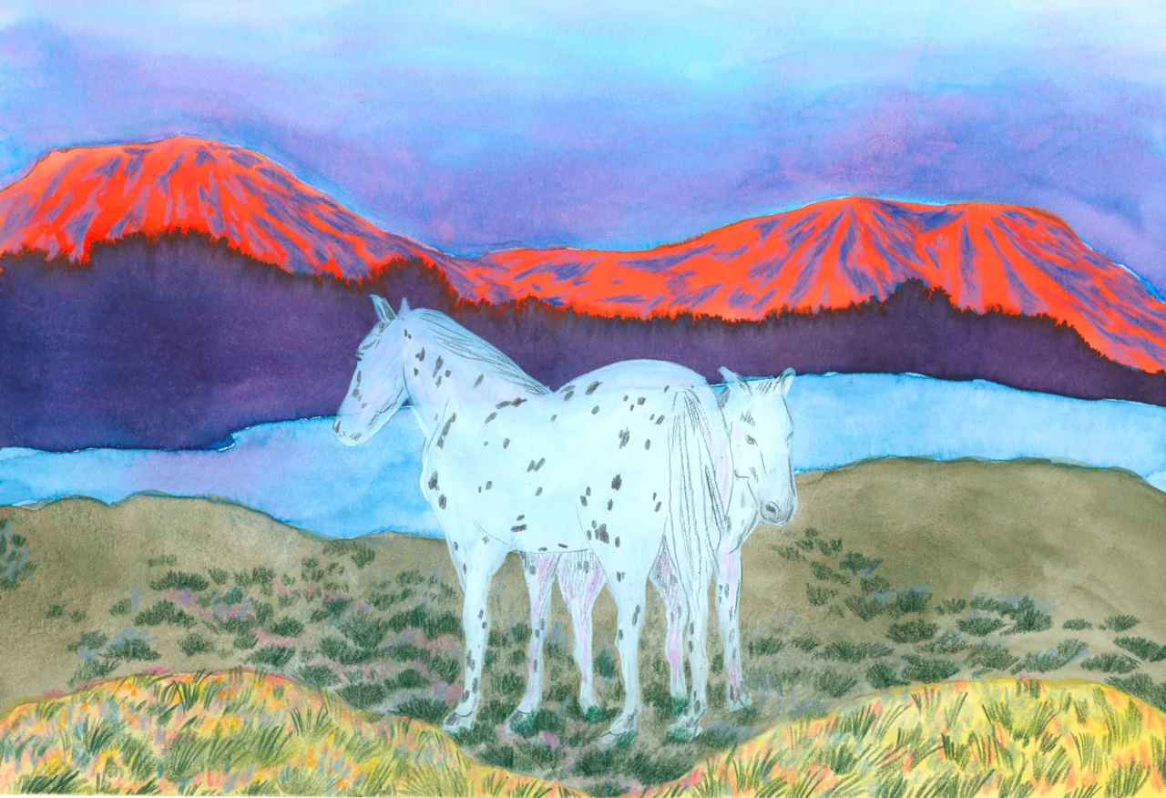 White horse standing in grassland with vibrant red-orange mountains and blue sky in the background